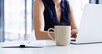 Laptop, typing and coffee with business person in office caffeine fix, energy boost and company report. Antioxidants, aroma and espresso with mug and employee in agency for beverage and latte drink