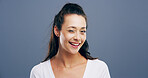 Wink, smile and portrait of woman in studio for secret, agreement and support gesture. Happiness, feedback and thank you with female person on background for review, achievement and well done sign