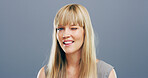 Wink, flirty and portrait of woman in studio for secret, agreement and support gesture. Happiness, feedback and thank you with female person on background for review, achievement and well done sign