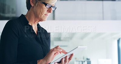 Buy stock photo Mature, business woman and browsing with tablet for research, schedule or design at office. Female person, web designer or creative user with technology for UI, UX or app development at workplace