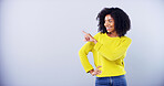 Advertising, smile and woman with pointing in studio for promo opportunity, offer announcement or mockup space. African person, ambassador or gesture for launch information or deal on blue background