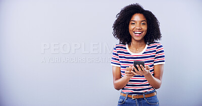 Buy stock photo Happy woman, phone and studio with portrait for online communication, social media or mockup space. Excited student, mobile and internet survey success, feedback or competition win on grey background