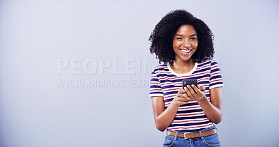 Buy stock photo Portrait, phone and happy woman in studio with internet for online results, social media and mockup. Excited student, cellphone and feedback for scholarship, application approval and grey background