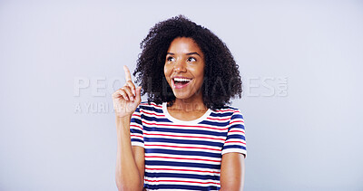 Buy stock photo Shocked, woman and student pointing in studio with college announcement, scholarship news and sign up. African, person and good idea with education offer, information guide and blue background space