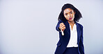 Woman, thumbs down and portrait for gesture in studio, review or dislike emoji on gray background. African model, upset and negative feedback for decision, rejection sign and complaint mockup space