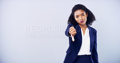 Buy stock photo Woman, thumbs down and portrait for gesture in studio, review or dislike emoji on gray background. African model, upset and negative feedback for decision, rejection sign or complaint at mockup space