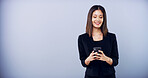 Business woman, phone and studio with internet for online communication, social media and space. Corporate contact, cellphone and person typing for chat, feedback and proposal on grey background