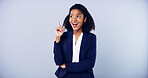 Smile, pointing and business woman with space in studio for approval on gray background. Announcement, accountant and African model with promotion, support and agreement for career mockup space
