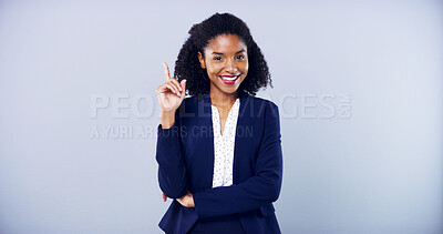 Buy stock photo Portrait, pointing up and business woman with space in studio for approval on gray background. Announcement, accountant and African model with promotion, support or agreement for career choice mockup