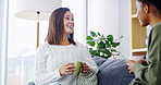 Laugh, coffee and relax with friends on sofa for bonding, women and social reunion. Happy, caffeine and drink with people talking in living room at home for chat, news and connection together