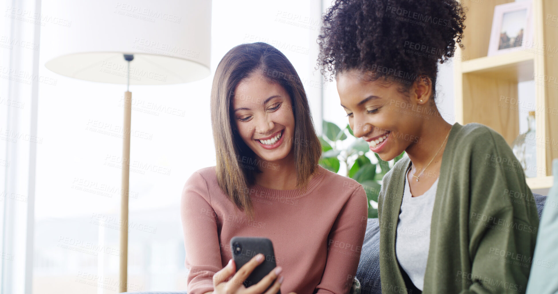 Buy stock photo Home, friends and laughing with smartphone for social media, funny video and bonding together on sofa. House, happy people and women with mobile for meme application, joke reel and relax with gossip