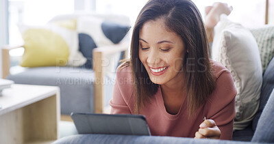 Buy stock photo Woman, happy and relax with tablet on sofa for online shopping, banking app or internet browsing. Person, smile or digital tech in home for social media scrolling, website connection or weekend break