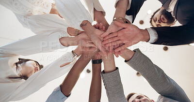 Buy stock photo Business, people and low angle with hands together in office for corporate celebration, collaboration support and goals. Group, employees and huddle for company solidarity, achievement and success