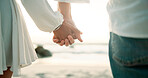 Holding hands, love and closeup with couple at beach for travel vacation, bonding and romantic date. Walk, summer holiday and marriage anniversary with man and woman outdoors for relax and adventure