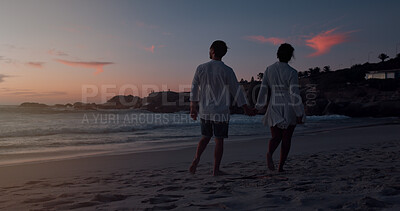 Buy stock photo Couple, holding hands and walking by sunset on beach, vacation holiday and bonding together for date. Back, man and woman with peace for love space, travel adventure and connection in relationship