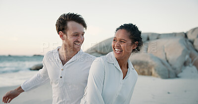 Buy stock photo Vacation, laugh and interracial couple at beach for love, care and playful for relationship. Ocean, happy man and woman outdoor for summer holiday, travel and funny joke on romantic date with partner