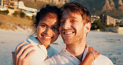 Buy stock photo Smile, couple and vacation at beach for love, care and interracial relationship together. Seashore, man and woman embrace outdoor for summer holiday, travel or romantic date with partner in portrait