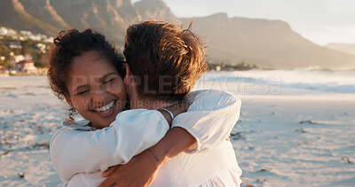Buy stock photo Hug, smile and couple at beach for love, care and interracial relationship together. Seashore, happy man and woman embrace outdoor for summer holiday, travel or romantic date with partner for support