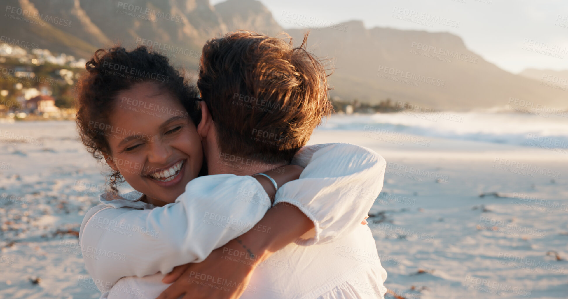 Buy stock photo Hug, smile and couple at beach for love, care and interracial relationship together. Seashore, happy man and woman embrace outdoor for summer holiday, travel or romantic date with partner for support