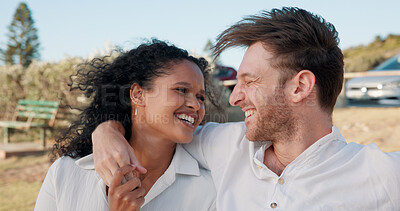 Buy stock photo Happy, interracial couple and laughing together outdoor for funny joke, relationship support and romantic weekend. Date, people and relax in nature for travel holiday, trust or commitment in marriage