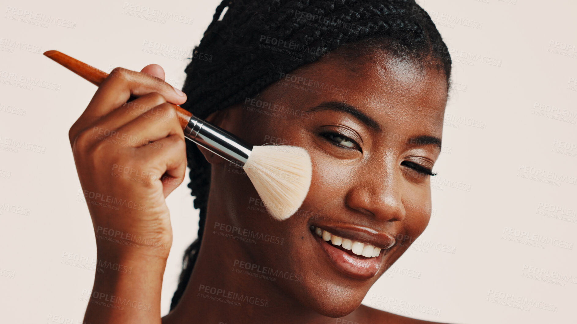 Buy stock photo Brush, makeup and black woman in studio with face, beauty or cosmetics for getting ready. Happy, cosmetology and African female person with blush for facial color or glow by white background.