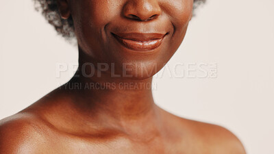 Buy stock photo Woman, mouth and skincare for face, studio and hydration of skin with cosmetics, happy and dermatology. White background, antiaging and treatment for black person with smile, shine and wellness