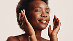 Happy, skincare and woman with glow, studio and hydration of skin with cosmetics, beauty and dermatology. White background, antiaging and treatment for black person with smile, shine and smooth face