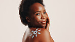Sunscreen, skincare and portrait with black woman in studio for beauty, uv protection and cosmetics. Glow, dermatology and spf lotion with person on white background for self care and sunblock cream