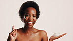 Smile, black woman and portrait with lotion in studio for hydration, treatment and sunscreen protection. Female person, cream and spf cosmetics for facial dermatology, anti aging and white background