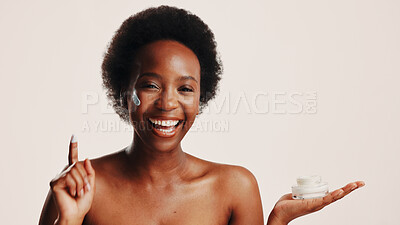Buy stock photo Smile, black woman and portrait with lotion in studio for hydration, treatment and sunscreen protection. Female person, cream and spf cosmetics for facial dermatology, anti aging and white background