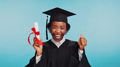 Buy stock photo Graduation, certificate and woman with thumbs up, studio and excited for achievement, university and happiness. Blue background, college and black person with gesture, portrait or smile for diploma