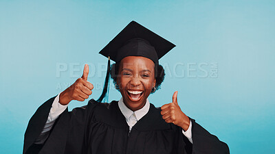 Buy stock photo Graduation, portrait and woman with thumbs up, success or excited for achievement, university and happiness. Blue background, college and black person with gesture, studio or smile for accomplishment