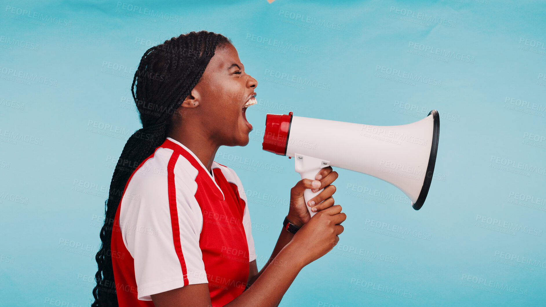 Buy stock photo Woman, loudspeaker and sports in studio with shout for inclusion, racism or fair pay in soccer by blue background. African athlete, girl and bullhorn for voice, profile or call to action for equality