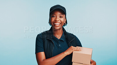 Buy stock photo Black woman, box and portrait in studio for delivery, customer service and friendly for client care. Courier person, package and smile on blue background for logistics, supply chain or ecommerce
