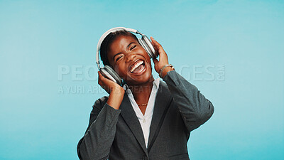 Buy stock photo Headphones, excited and business black woman in studio to relax with audio, music and playlist. Professional, corporate and person listening to radio, song and streaming track on blue background