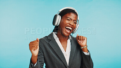 Buy stock photo Headphones, dance and business black woman in studio to relax with audio, track and playlist. Professional, corporate and person laugh listening to radio, song and streaming music on blue background