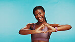 Studio, black woman and heart with hands for fitness, support or expression of love for wellness. Mockup, female person and excited with emoji sign for kindness, exercise or health by blue background