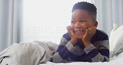 Buy stock photo Happy, thinking and African child on bed for daydreaming, wondering and imagine in morning. Family home, childhood and young boy in bedroom for resting, comfortable and relaxing with ideas on weekend