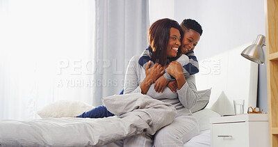 Buy stock photo Home, mother and son in bedroom, hug and bonding together with care, smile and relax. Black family, parent and mama with boy, resting and embrace with comfort, happiness and morning with love