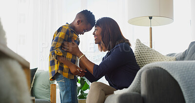 Buy stock photo Love, mother and touch forehead with kid in home for care, smile and family bonding together. African boy, mom and child in living room for connection, support and healthy relationship with parent