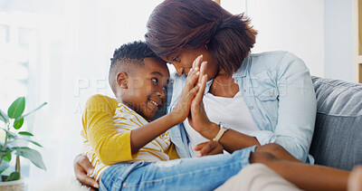 Buy stock photo Love, mom and child in living room, smile and black family in house, bonding and affection for boy. Home, woman and hug for son in morning, mother and parent with kid in apartment or happy on couch