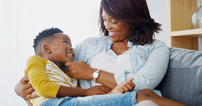 Buy stock photo Love, mother and child on lap in home for care, happy and family bonding together. African kid, mom and boy in living room for connection, support and play for relationship with parent on mothersday