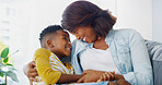 Care, mother and forehead touch with child in home for love, happy or family bonding together. African kid, mom or embrace boy on lap in living room for connection, trust or holding hands with parent