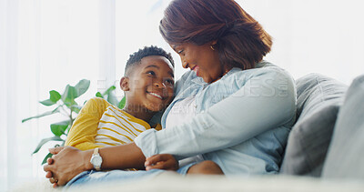 Buy stock photo African mom, smile and embrace child in home for trust, care or family bonding together. Mama, kid and boy in living room for love on lap, support or healthy relationship with parent on mothers day