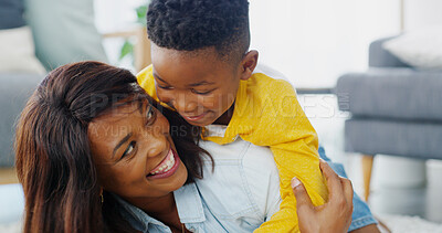 Buy stock photo Fun, mom and child in living room, smile and games for black family in house, love and care for boy. Apartment, woman and playing with son in lounge, mother and happy with kid on floor or relax