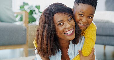 Buy stock photo Portrait, mother and piggyback kid in home for care, happiness and family bonding together. African child, boy and hug mom in living room for connection, support and love with single parent in Kenya