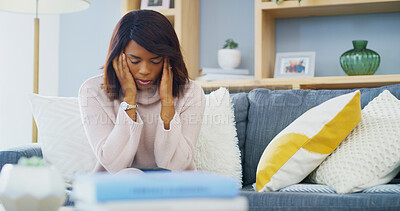 Buy stock photo Black woman, headache and pain on sofa in home with job loss, financial burnout and emotional distress. Crisis, debt or inflation worry with migraine for unemployment stress with fatigue in house