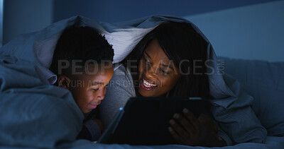 Buy stock photo Night, mother and child with tablet in bed for watching cartoon, streaming service and online movie. Black family, happy woman and kid in home with digital app for reading bedtime ebook and bonding