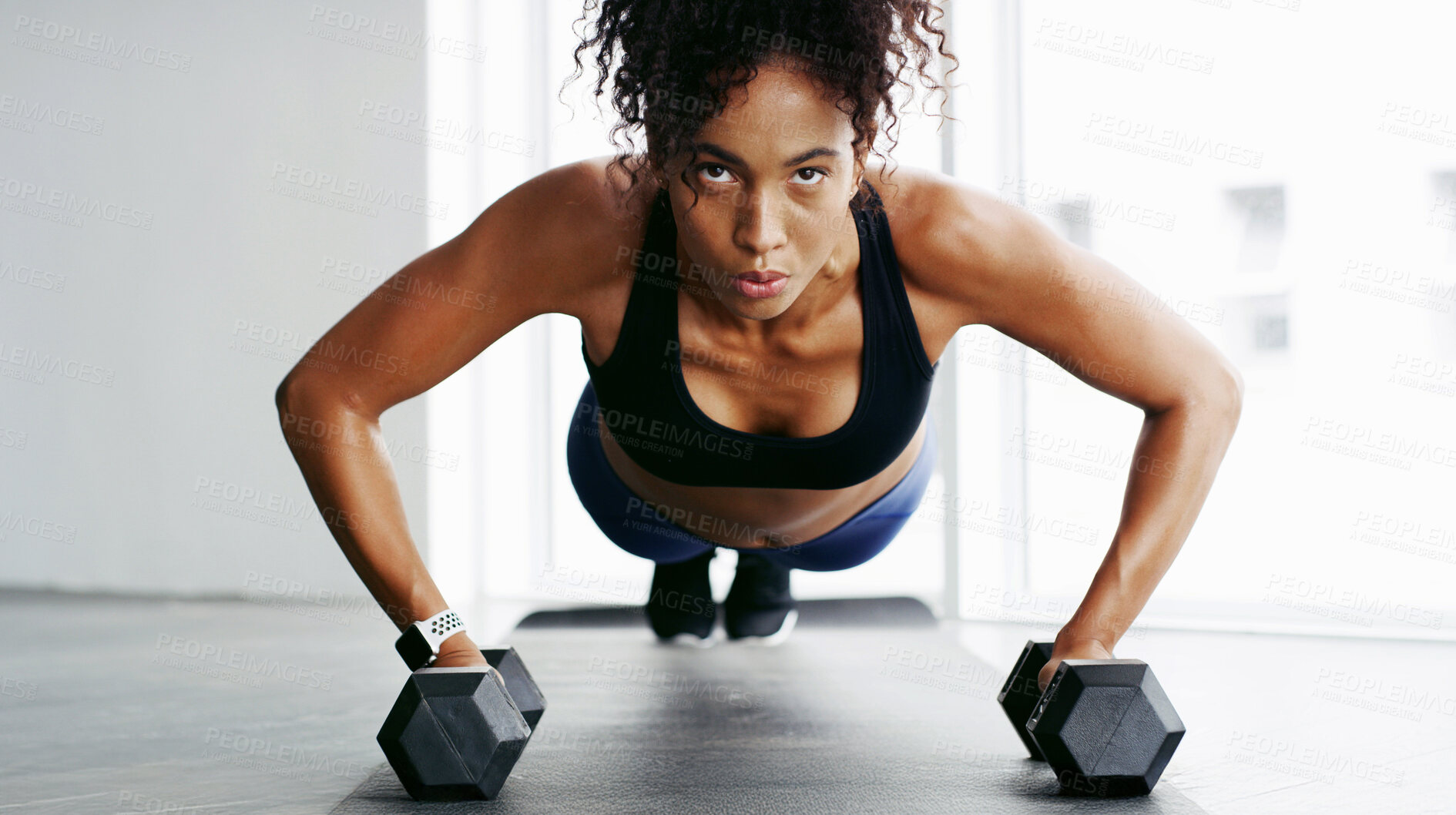 Buy stock photo Woman, dumbbells and push up on floor, gym and balance with power, challenge and exercise in morning. Girl, bodybuilder and strong with equipment, fitness and growth with change at wellness club