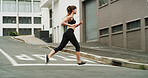 Running, exercise and woman with earphones, outdoor and practice for marathon in morning, speed and blurred. Fitness, runner and person on road for sports, athlete and training with energy for cardio